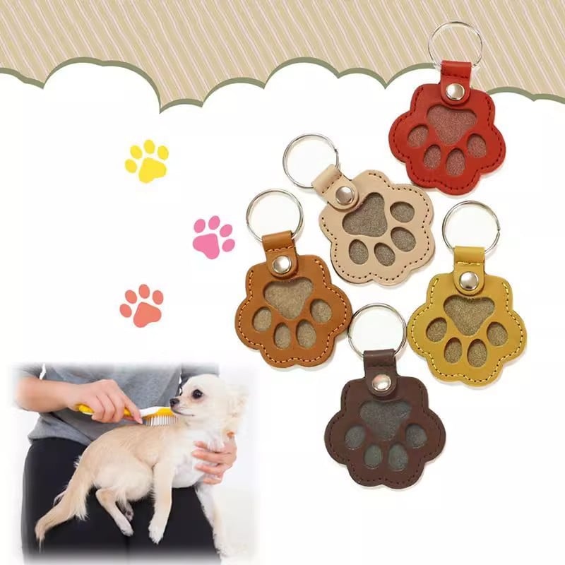 Llavero con huella de pata para recordar a una mascota, de cuero — compartimento oculto para un recuerdo
