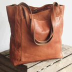 Elegant black shoulder bag made from durable PU leather with adjustable strap and organized interior compartments - Euroselle