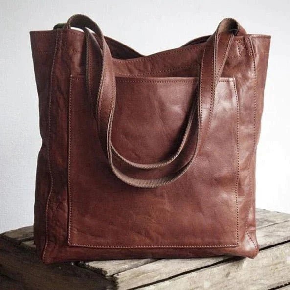 Elegant black shoulder bag made from durable PU leather with adjustable strap and organized interior compartments - Euroselle