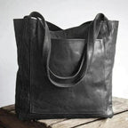 Elegant black shoulder bag made from durable PU leather with adjustable strap and organized interior compartments - Euroselle
