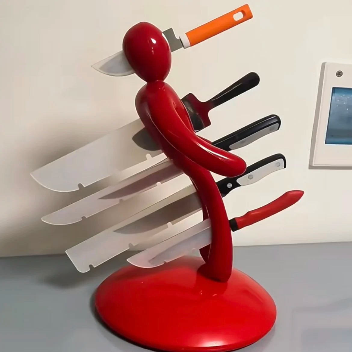 Artistic humanoid knife organizer with secure blade storage and space-saving countertop design for modern kitchen aesthetics - Euroselle