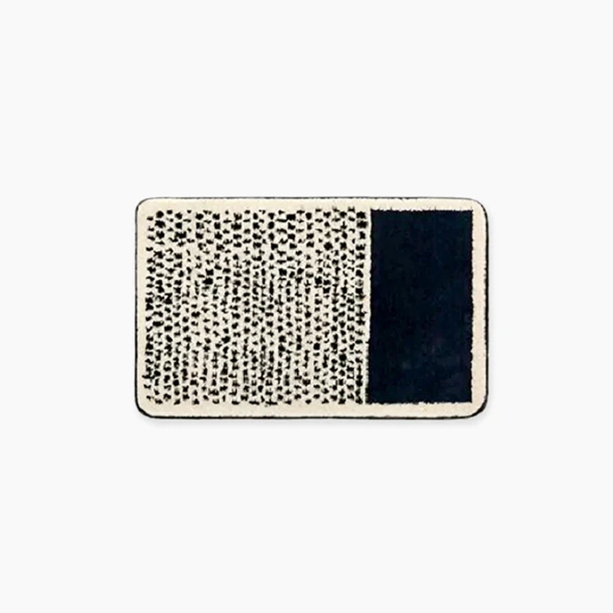 Tapis de bain artisanal NovaLoom — motif abstrait et adhérence antidérapante