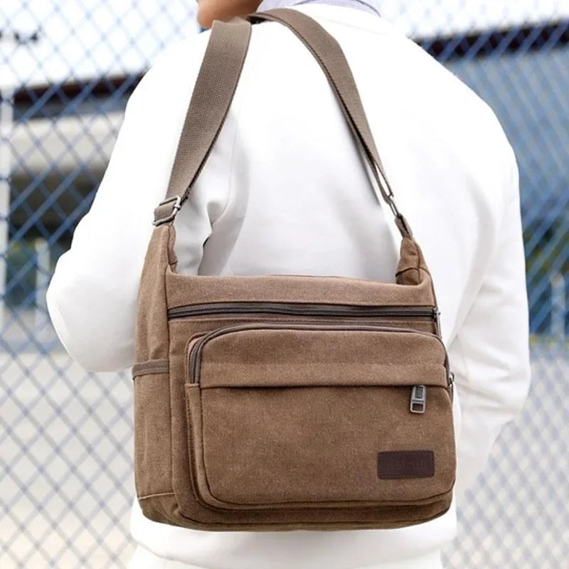 Bolso bandolera de lona — correa ajustable, bolsillos con cremallera