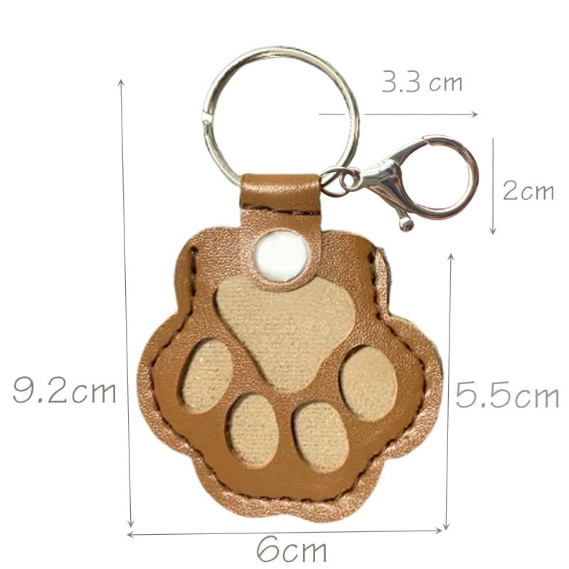 Llavero con huella de pata para recordar a una mascota, de cuero — compartimento oculto para un recuerdo