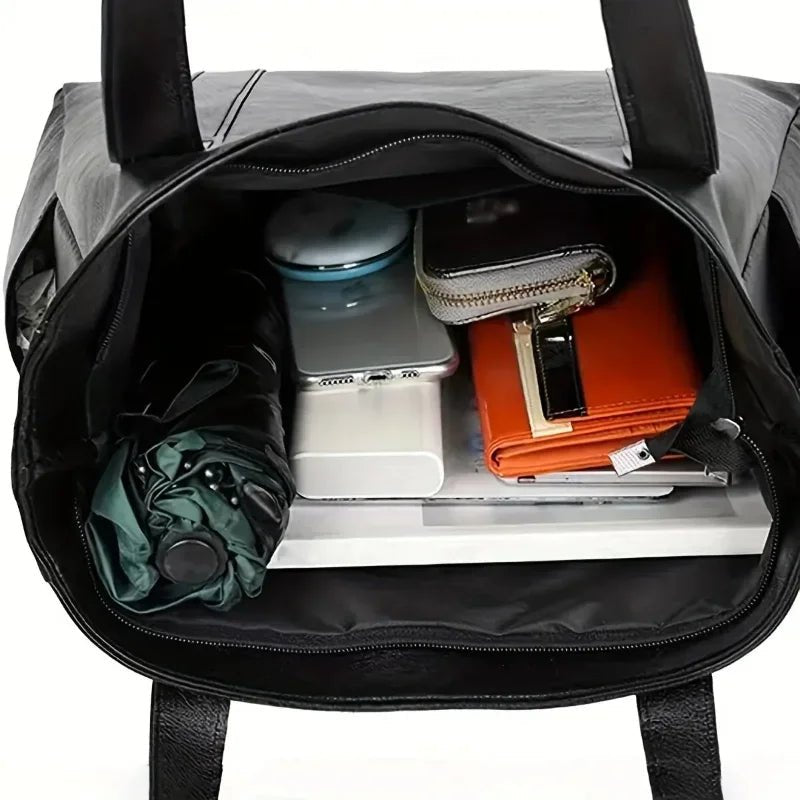 Elegante borsa a spalla in pelle dallo stile rétro e dalla superficie liscia | Euroselle
