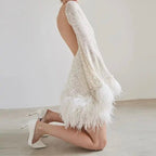 Mini fitted dress for women with sequin hem and feathers | Euroselle