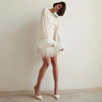 Mini fitted dress for women with sequin hem and feathers | Euroselle